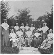 SA0163 - Photo of eleven women and two men; some are seated. Taken from a stereograph., Winterthur Shaker Photograph and Post Card Collection 1851 to 1921c